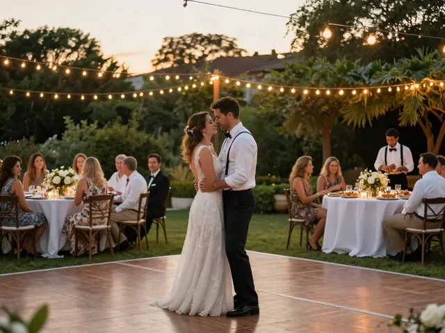 Outdoor wedding reception showcasing event rentals with elegant décor and joyful couple dancing.